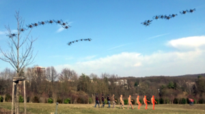 Markerless Outdoor Human Motion Capture Using Multiple Autonomous Micro Aerial Vehicles
